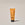 Acure Radically Rejuvenating SPF 30 Day Cream in a sleek yellow tube, standing upright on a clean background.